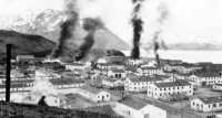 1942: Burning buildings at Ft. Mears after first enemy attack on Dutch Harbor, 3 June 1942.  [Naval Archives]